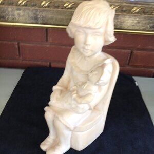 Adorable  Clay Sculpture of a Child Holding her Doll